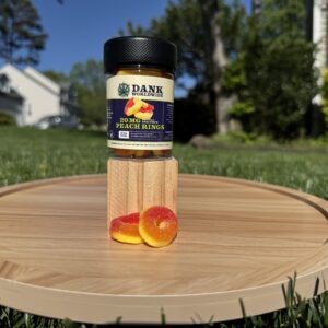 a product photo of the 20mg peach ring gummies in a container
