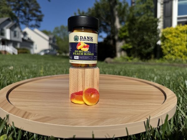 a product photo of the 20mg peach ring gummies in a container